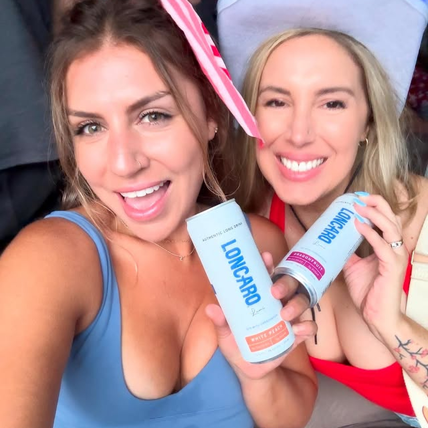 Two girls showing bottles